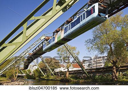 Suspension railway, WSW GTW Generation 15, over the river Wupper, Wuppertal, Bergisches Land, North Rhine-Westphalia, Germany, Europe View Large Photo Image Stock Photography - Suspension railway, WSW GTW Generation 15, over the river Wupper, Wuppertal, Bergisches Land, North Rhine-Westphalia, Germany, Europe. Fotosearch