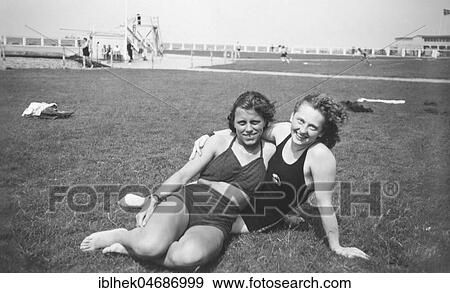 Swimwear, two friends in a swimming pool, 1940s, Germany, Europe View Large Photo Image Stock Photo - Swimwear, two friends in a swimming pool, 1940s, Germany, Europe. Fotosearch