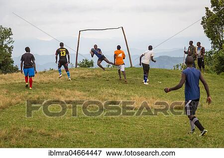 Stock Photo - Teenagers at football match, Bwindi Impenetrable National Park, Uganda, Africa. Fotosearch