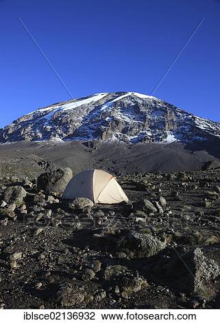 Stock Image - Tent with a view to the summit of Mount Kilimanjaro, as seen from the Barranco Hut, Tanzania, Africa. Fotosearch