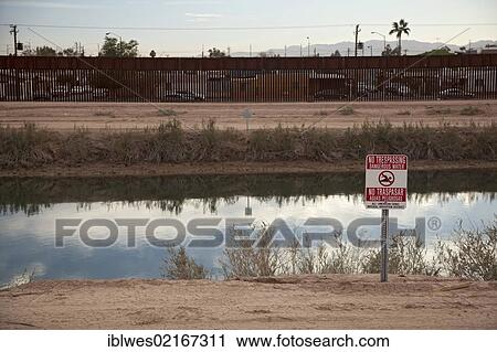 The All-American Canal, which brings water from the Colorado River to irrigate the Imperial Valley, only a few meters north of the international border fence; more than 500 people have drowned in the canal, many of them migrants from Mexico trying to... View Large Photo Image Stock Image - The All-American Canal, which brings water from the Colorado River to irrigate the Imperial Valley, only a few meters north of the international border fence; more than 500 people have drowned in the canal, many of them migrants from Mexico trying to.... Fotosearch