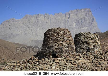 The Beehive Tombs of Al-Ayn on the edge of Jebel Misht mountain ridge, in the area between the towns of Bat and Al-Ayn in the Hajar Mountains, UNESCO World Heritage Site, Oman, Arabian Peninsula, Middle East, Asia View Large Photo Image Picture - The Beehive Tombs of Al-Ayn on the edge of Jebel Misht mountain ridge, in the area between the towns of Bat and Al-Ayn in the Hajar Mountains, UNESCO World Heritage Site, Oman, Arabian Peninsula, Middle East, Asia. Fotosearch