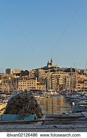 The Old Harbour, Vieux Port, with Basilica Notre Dame de la Garde in the distance, Marseille, Marseilles, Provence-Alpes-Côte d'Azur, France, Europe View Large Photo Image Stock Photograph - The Old Harbour, Vieux Port, with Basilica Notre Dame de la Garde in the distance, Marseille, Marseilles, Provence-Alpes-Côte d'Azur, France, Europe. Fotosearch
