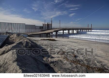 The U. S. Border Patrol's "Surf Fence Project" extends the border fence between the United States and Mexico further into the Pacific Ocean, San Ysidro, California, USA, North America View Large Photo Image Stock Photograph - The U. S. Border Patrol's "Surf Fence Project" extends the border fence between the United States and Mexico further into the Pacific Ocean, San Ysidro, California, USA, North America. Fotosearch