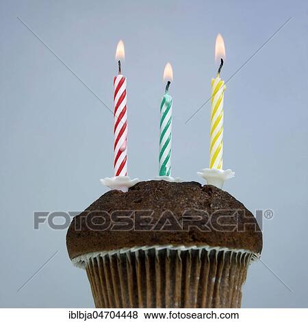 Three candles on a cake, studio shot, still View Large Photo Image Stock Photo - Three candles on a cake, studio shot, still. Fotosearch
