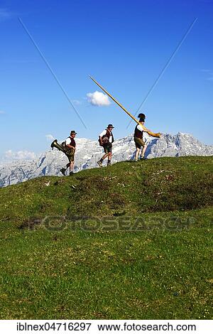 Three folk musicians, Bergfexn trio in traditional costume on the Eggenalm, behind Loferer Steinberge, Reit im Winkl, Bavaria, Upper Bavaria, Germany, Europe View Large Photo Image Stock Photo - Three folk musicians, Bergfexn trio in traditional costume on the Eggenalm, behind Loferer Steinberge, Reit im Winkl, Bavaria, Upper Bavaria, Germany, Europe. Fotosearch
