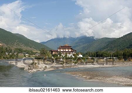 Tibetan Buddhism, fortess-monastery by the river, Dzong, forested mountains, Punakha, the Himalayas, Kingdom of Bhutan, South Asia, Asia View Large Photo Image Stock Image - Tibetan Buddhism, fortess-monastery by the river, Dzong, forested mountains, Punakha, the Himalayas, Kingdom of Bhutan, South Asia, Asia. Fotosearch