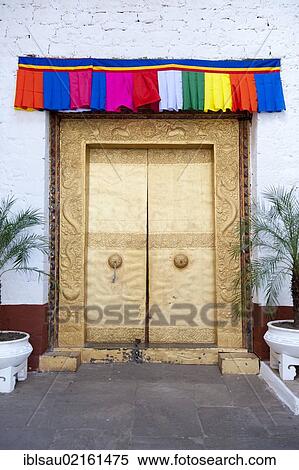 Stock Photography - Tibetan Buddhism, gold-studded door, gate, entrance, fortress-monastery, Dzong, Punakha, the Himalayas, Kingdom of Bhutan, South Asia, Asia. Fotosearch