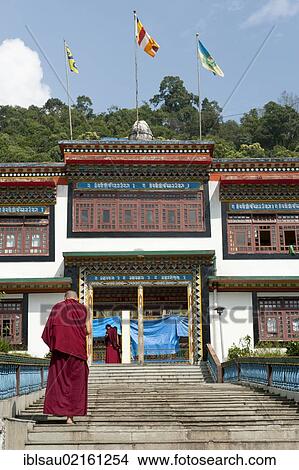 Tibetan Buddhism, Karma-Kagyu Lineage, monk climbing stairs, Lingdum Gompa Monastery near Gangtok, Sikkim, Himalayas, India, South Asia, Asia View Large Photo Image Picture - Tibetan Buddhism, Karma-Kagyu Lineage, monk climbing stairs, Lingdum Gompa Monastery near Gangtok, Sikkim, Himalayas, India, South Asia, Asia. Fotosearch