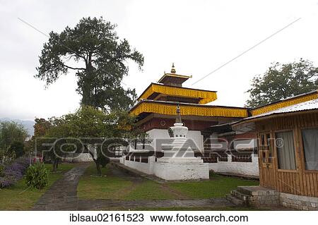 Tibetan Buddhism, Kyichu Lhakhang Temple and a small stupa and a large tree, near Paro, Himalayas, Bhutan, South Asia, Asia View Large Photo Image Stock Image - Tibetan Buddhism, Kyichu Lhakhang Temple and a small stupa and a large tree, near Paro, Himalayas, Bhutan, South Asia, Asia. Fotosearch