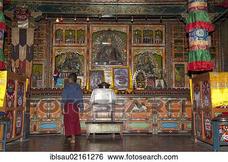 Tibetan Buddhism, novice standing in front of the altar, Yung Drung Kundrak Lingbon Monastery, Bon Sect, near Ravangla, Sikkim, Himalayas, India, South Asia, Asia View Large Photo Image Stock Photograph - Tibetan Buddhism, novice standing in front of the altar, Yung Drung Kundrak Lingbon Monastery, Bon Sect, near Ravangla, Sikkim, Himalayas, India, South Asia, Asia. Fotosearch