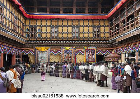 Tibetan Buddhist festival, people wearing the traditional Gho robe standing in a queue, Rinpung Dzong Monastery and Fortress, courtyard, Paro, Himalayas, Bhutan, South Asia, Asia View Large Photo Image Stock Photo - Tibetan Buddhist festival, people wearing the traditional Gho robe standing in a queue, Rinpung Dzong Monastery and Fortress, courtyard, Paro, Himalayas, Bhutan, South Asia, Asia. Fotosearch