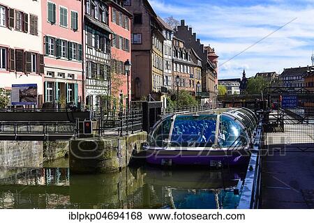 Stock Photo - Tourist boat at a lock, Strasbourg, Alsace, France, Europe. Fotosearch