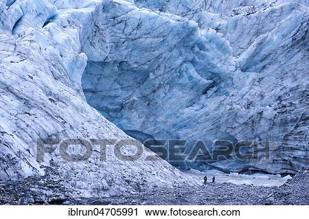 Tourist hiking to the giant glacial outflow of Fox Glacier, South Island, New Zealand, Oceania View Large Photo Image Stock Image - Tourist hiking to the giant glacial outflow of Fox Glacier, South Island, New Zealand, Oceania. Fotosearch