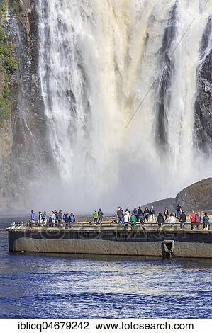 Stock Image - Tourists in front of Montmorency Falls, Québec Province, Canada, North America. Fotosearch