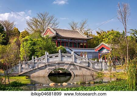 Traditional Chinese bridge and temple, The Xiamen International Garden and Flower Expo Park, Jimei Distric, Xiamen, Fujian, China, Asia View Large Photo Image Stock Photo - Traditional Chinese bridge and temple, The Xiamen International Garden and Flower Expo Park, Jimei Distric, Xiamen, Fujian, China, Asia. Fotosearch