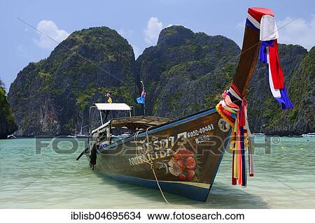 Picture - Traditional longtail boat, Maja Beach, Phi Phi Island, Thailand, Asia. Fotosearch