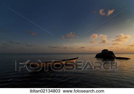 Traditional Malagasy boat near the beach at sunset, Madagascar, Africa View Large Photo Image Stock Image - Traditional Malagasy boat near the beach at sunset, Madagascar, Africa. Fotosearch