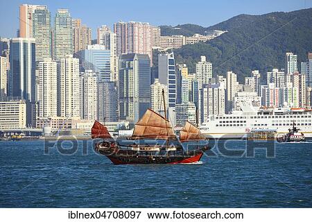 Stock Photo - Traditional sailboat, junk in front of the skyline, Hong Kong, China, Asia. Fotosearch