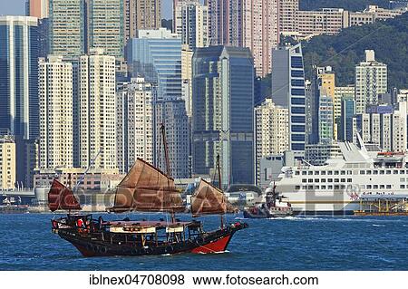 Traditional sailboat, junk in front of the skyline, Hong Kong, China, Asia View Large Photo Image Stock Photo - Traditional sailboat, junk in front of the skyline, Hong Kong, China, Asia. Fotosearch