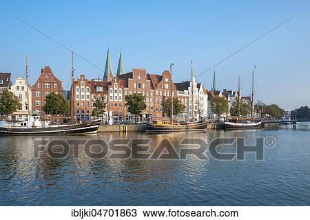 Stock Image - Traditional sailing boat on the Untertrave, Historic Houses, Lübeck, Schleswig-Holstein, Germany, Europe. Fotosearch