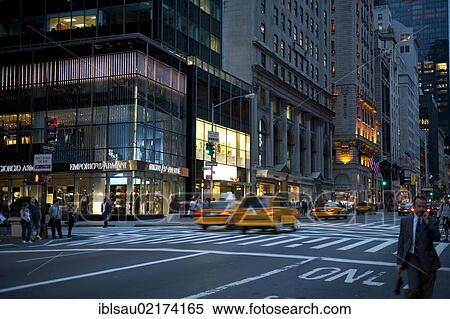 Traffic at dusk, yellow cabs, taxis, Armani store at back, 5th Avenue, Midtown, Manhattan, New York City, USA, North America, America, North America View Large Photo Image Stock Photography - Traffic at dusk, yellow cabs, taxis, Armani store at back, 5th Avenue, Midtown, Manhattan, New York City, USA, North America, America, North America. Fotosearch