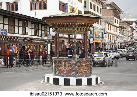 Traffic cop directing traffic by hand signal, Norzin Lam Street, town centre, capital of Thimphu, Kingdom of Bhutan, South Asia, Asia View Large Photo Image Stock Image - Traffic cop directing traffic by hand signal, Norzin Lam Street, town centre, capital of Thimphu, Kingdom of Bhutan, South Asia, Asia. Fotosearch