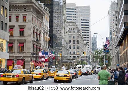 Stock Image - Traffic in the metropolis, yellow cabs, taxis in 5th Avenue, Manhattan, New York City, New York, USA, North America, America, North America. Fotosearch
