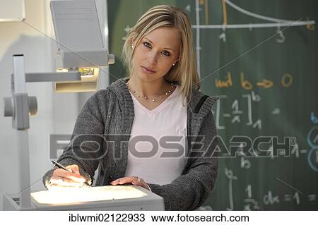 Trainee teacher, prospective teacher, young teacher, mathematics, blackboard, classroom, overhead projector, Baden-Wuerttemberg, Germany, Europe View Large Photo Image Stock Image - Trainee teacher, prospective teacher, young teacher, mathematics, blackboard, classroom, overhead projector, Baden-Wuerttemberg, Germany, Europe. Fotosearch