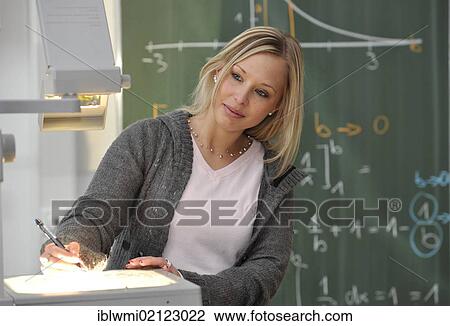 Trainee teacher, prospective teacher, young teacher, mathematics, blackboard, classroom, overhead projector, Baden-Wuerttemberg, Germany, Europe View Large Photo Image Stock Image - Trainee teacher, prospective teacher, young teacher, mathematics, blackboard, classroom, overhead projector, Baden-Wuerttemberg, Germany, Europe. Fotosearch