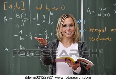 Trainee teacher, prospective teacher, young teacher, mathematics, blackboard, classroom, Baden-Wuerttemberg, Germany, Europe View Large Photo Image Stock Photo - Trainee teacher, prospective teacher, young teacher, mathematics, blackboard, classroom, Baden-Wuerttemberg, Germany, Europe. Fotosearch