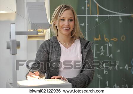 Trainee teacher, prospective teacher, young teacher, mathematics, blackboard, classroom, overhead projector, Baden-Wuerttemberg, Germany, Europe View Large Photo Image Stock Photograph - Trainee teacher, prospective teacher, young teacher, mathematics, blackboard, classroom, overhead projector, Baden-Wuerttemberg, Germany, Europe. Fotosearch