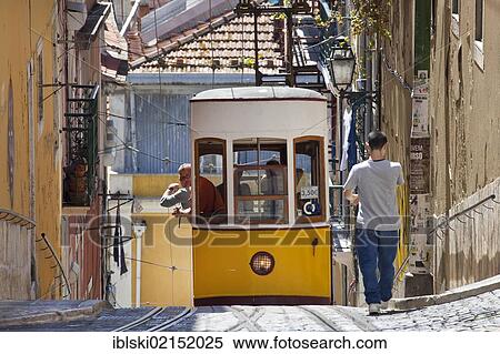 Tram of the Elevador da Bica funicular railway in the district of Bairro Alto, Lisbon, Portugal, Europe View Large Photo Image Stock Photography - Tram of the Elevador da Bica funicular railway in the district of Bairro Alto, Lisbon, Portugal, Europe. Fotosearch