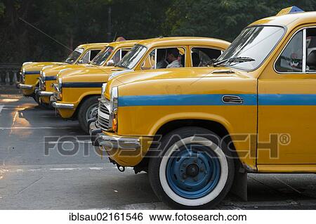 Transportation, four yellow Ambassador taxis in a row, Chowringhee, Calcutta, Kolkata, West Bengal, India, South Asia, Asia View Large Photo Image Stock Photograph - Transportation, four yellow Ambassador taxis in a row, Chowringhee, Calcutta, Kolkata, West Bengal, India, South Asia, Asia. Fotosearch