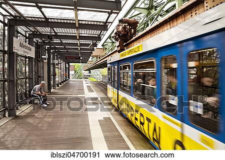 Stock Image - Travelling suspension railway at the station Adlerbrücke, Wuppertal, Bergisches Land, North Rhine-Westphalia, Germany, Europe. Fotosearch
