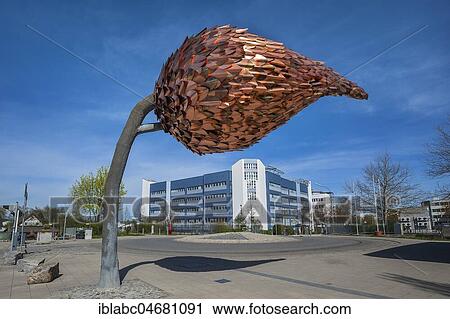 Tree with a trunk of iron and leaves of copper, artist Melanie Stiehl, at Unterföhringer tram station, Munich, Upper Bavaria, Bavaria, Germany, Europe View Large Photo Image Stock Image - Tree with a trunk of iron and leaves of copper, artist Melanie Stiehl, at Unterföhringer tram station, Munich, Upper Bavaria, Bavaria, Germany, Europe. Fotosearch