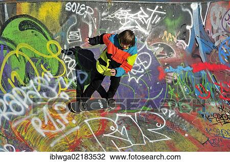 Stock Image - Twelve-year-old skater in a skateboard track, skate bowl, Brussels, Belgium, Europe, PublicGround, Europe. Fotosearch