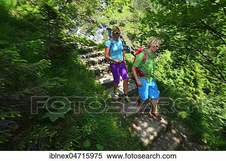 Stock Photography - Two hikers at the Hausbach Fallsteig, Reit im Winkl, Chiemgau, Bavaria, Germany, Europe. Fotosearch