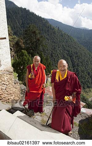 Two monks in red robes, Cheri Goemba Monastery, Chagri Dorjeden Monastery, near Thimphu, Kingdom of Bhutan, South Asia, Asia View Large Photo Image Stock Photo - Two monks in red robes, Cheri Goemba Monastery, Chagri Dorjeden Monastery, near Thimphu, Kingdom of Bhutan, South Asia, Asia. Fotosearch