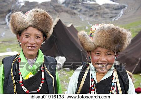 Two smiling Tibetan women wearing fur caps, portrait, camp on the Karo-La glacier, between Nanggartse and Gyantse, Himalaya Range, Central Tibet, Ue-Tsang, Tibet Autonomous Region, People's Republic of China, Asia View Large Photo Image Stock Image - Two smiling Tibetan women wearing fur caps, portrait, camp on the Karo-La glacier, between Nanggartse and Gyantse, Himalaya Range, Central Tibet, Ue-Tsang, Tibet Autonomous Region, People's Republic of China, Asia. Fotosearch