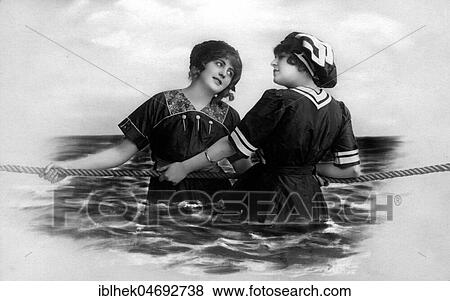 Stock Photo - Two women pulling a rope in the sea, scenery, 1910s, Germany, Europe. Fotosearch