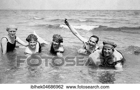 Stock Image - Vacation, four women and a man bathing in the sea, 1920s, Usedom, Baltic Sea, Germany, Europe. Fotosearch