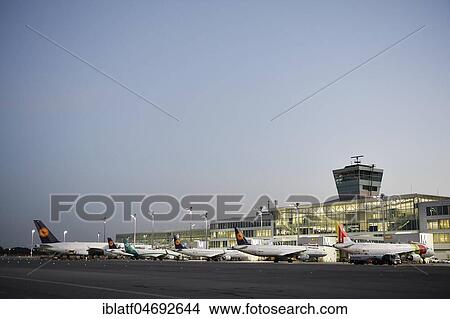 Various airlines at Terminal 2, dusk, Munich Airport, Upper Bavaria, Bavaria, Germany, Europe View Large Photo Image Picture - Various airlines at Terminal 2, dusk, Munich Airport, Upper Bavaria, Bavaria, Germany, Europe. Fotosearch