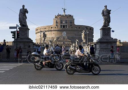 Stock Photo - Vespa drivers and Ponte Sant'Angelo bridge with the Castel Sant'Angelo, Rome, Italy, Europe. Fotosearch