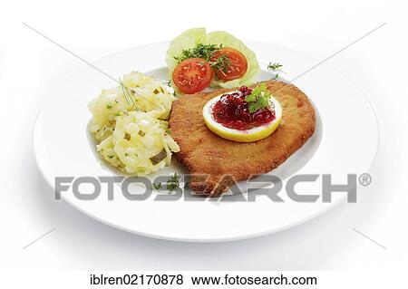 Viennese Schnitzel with lemon and cranberries, potato salad View Large Photo Image Stock Photo - Viennese Schnitzel with lemon and cranberries, potato salad. Fotosearch