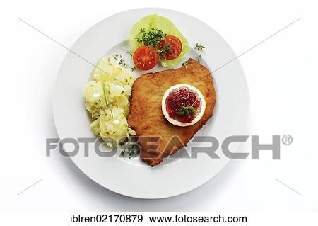 Viennese Schnitzel with lemon and cranberries, potato salad View Large Photo Image Stock Photo - Viennese Schnitzel with lemon and cranberries, potato salad. Fotosearch