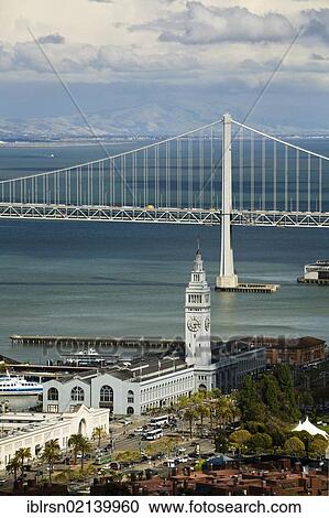 Stock Image - View from Coit Tower over San Francisco Bay with the Oakland Bay Bridge and the Ferry Building, San Francisco, California, USA, North America. Fotosearch
