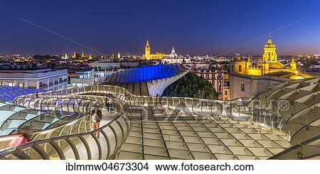 Picture - View from Metropol Parasol to numerous churches in the evening, Iglesia de la Anunciación, La Giralda and Iglesia del Salvador, bell tower of the Cathedral of Sevilla, Catedral de Santa Maria de la Sede, Sevilla, Andalusia, Spain, Europe. Fotosearch