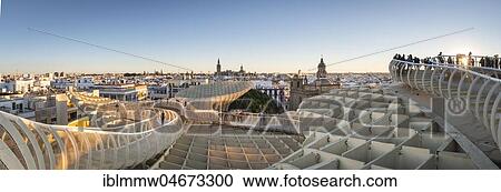 Stock Image - View from Metropol Parasol to numerous churches at sunset, Iglesia de la Anunciación, La Giralda and Iglesia del Salvador, bell tower of the Cathedral of Sevilla, Catedral de Santa Maria de la Sede, Sevilla, Andalusia, Spain, Europe. Fotosearch