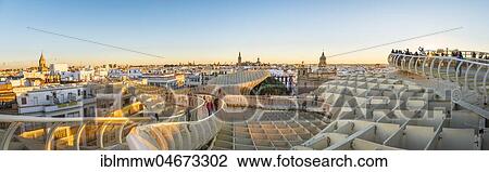 Stock Image - View from Metropol Parasol to numerous churches at sunset, Iglesia de la Anunciación, La Giralda and Iglesia del Salvador, bell tower of the Cathedral of Sevilla, Catedral de Santa Maria de la Sede, Sevilla, Andalusia, Spain, Europe. Fotosearch